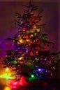 Illuminated different color Christmas night tree Royalty Free Stock Photo