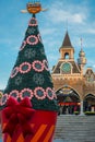 Illuminated Christmas Tree with large stars, cone shaped evening