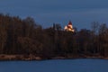 Illuminated church above a lake in Bavaria