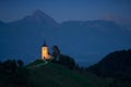 Illuminated The Church of St. Primoz and Felicijan in the village of Jamnik in the Slovenian Alps at night Royalty Free Stock Photo