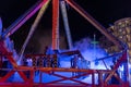 Illuminated colorful attraction at the fair at night