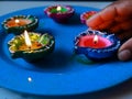 Illuminated diya placed in a plate Royalty Free Stock Photo