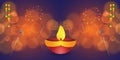 Illuminated diyas Oil Lamps and firecracker  rocket  on blurred bokeh background for Diwali celebration Royalty Free Stock Photo