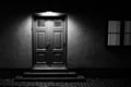 Illuminated door with stairs at night