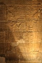 Illuminated Egyptian hieroglyphs from Temple of Isis from Philae Aswan (Egypt) Royalty Free Stock Photo