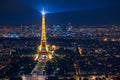 Illuminated Eiffel Tower and panoramic aerial view of Paris