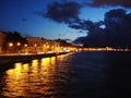 Illuminated embankment of river Neva in the summer night