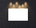 Illuminated empty frame mock up on dark brick wall. 3D illustrating. Royalty Free Stock Photo