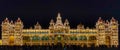 Illuminated facade of the Mysore Palace at night, India.