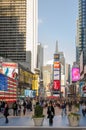 Illuminated facades of Broadway stores and theaters