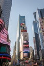 Illuminated facades of Broadway stores and theaters