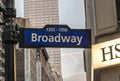 Illuminated facades of Broadway stores and theaters