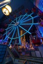 Illuminated ferris wheel in an indoor playgroud