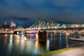 The illuminated footbridge called Eiserner Steg which crosses the river Main in Frankfurt at night Royalty Free Stock Photo