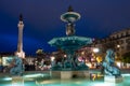 Illuminated fountain with Column of Pedro IV at Rossio Square in Lisbon, Portugal Royalty Free Stock Photo