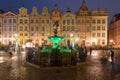 Illuminated fountain of the Neptune in Old Town of Gdansk at night. Poland Royalty Free Stock Photo