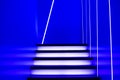 Illuminated futuristic staircase in blue neon lights