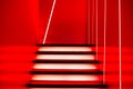 Illuminated futuristic staircase in red neon lights