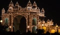 Illuminated gate of Mysore city palace at night