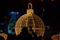 Illuminated giant Christmas ball decoration placed outdoors