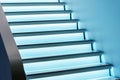 Illuminated glass steps. Home staircase with railings in a large house. Close-up Royalty Free Stock Photo