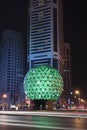 Illuminated globe at Friendship Square at night, Dalian, China