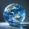Illuminated Globe of Planet Earth on a Reflective Surface Royalty Free Stock Photo