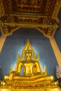 Illuminated golden Buddha inside a Thai temple, Bangkok, Thailand. Royalty Free Stock Photo