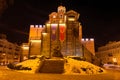 Illuminated Golden Gates and Yaroslav the Wise monument at winter night. Kyiv, Ukraine