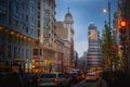 Illuminated Gran Via Street with Edificio Capitol Building and Schweppes neon sign - Madrid, Spain