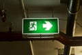 Illuminated green exit sign. Royalty Free Stock Photo