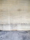 Illuminated grunge metallic roller shutter door Royalty Free Stock Photo