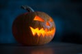 Illuminated halloween pumpkin on black background