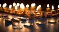 Illuminated Hanukkah Menorah on Table with Dreidels and Gelt