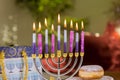 An illuminated Hanukkiah Menorah symbolizes a Jewish Hanukkah festival of lights