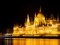 Illuminated historical building of Hungarian Parliament on Danube River Embankment in Budapest by night Royalty Free Stock Photo