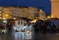 Illuminated horse drawn carriage at Main Market Square at Christmas time. Krakow, Poland Royalty Free Stock Photo