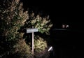 Illuminated hotel sign showing visitors the way to the reception area and also places to park. Royalty Free Stock Photo