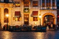 Illuminated houses at the Grand Place square at night in Brussels, Belgium Royalty Free Stock Photo