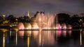 Illuminated Ibirapuera Park At Night. Modern Skyscrapers, Reflection On The Lake And Floating Fountain. High Water Jets, Miracle