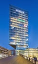 Illuminated Kennedy office tower at twilight, Eindhoven, The netherlands
