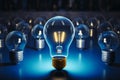 Illuminated lamp among blue lightbulbs showcases smart problem solving