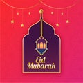 Illuminated lantern with golden text Eid Mubarak with hanging go