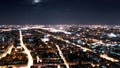 Illuminated large city at night aerial panoramic view