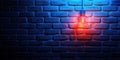 Illuminated light bulb against blue brick wall, warm glow, textured surface Royalty Free Stock Photo
