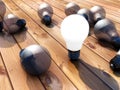 Illuminated lightbulb and parquet Royalty Free Stock Photo