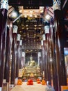 Beautiful shiny,teak interior of Wat Lok Moli, Lanna wood-carved Buddhist temple,at night,Chiang Mai,Thailand