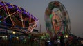 Illuminated lights of swings, long shutter of Ferris wheel Royalty Free Stock Photo