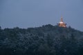 Illuminated Ling Jiou Buddhist temple on a mountain in Taipei, Taiwan in the evening Royalty Free Stock Photo