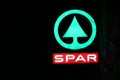 illuminated logo of supermarket SPAR in the night in the city center of The Hague in the Netherlands